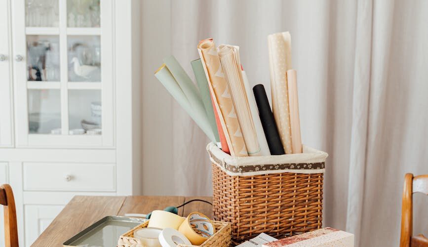 wrapping papers on brown woven basket