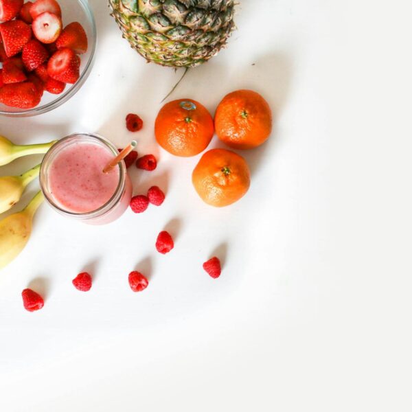 assorted fruits on white surface