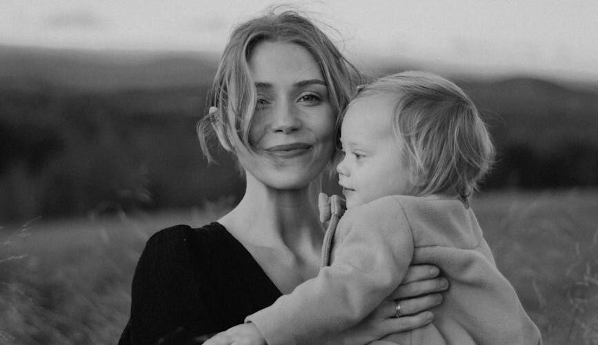 black and white portrait of mother and child outdoors