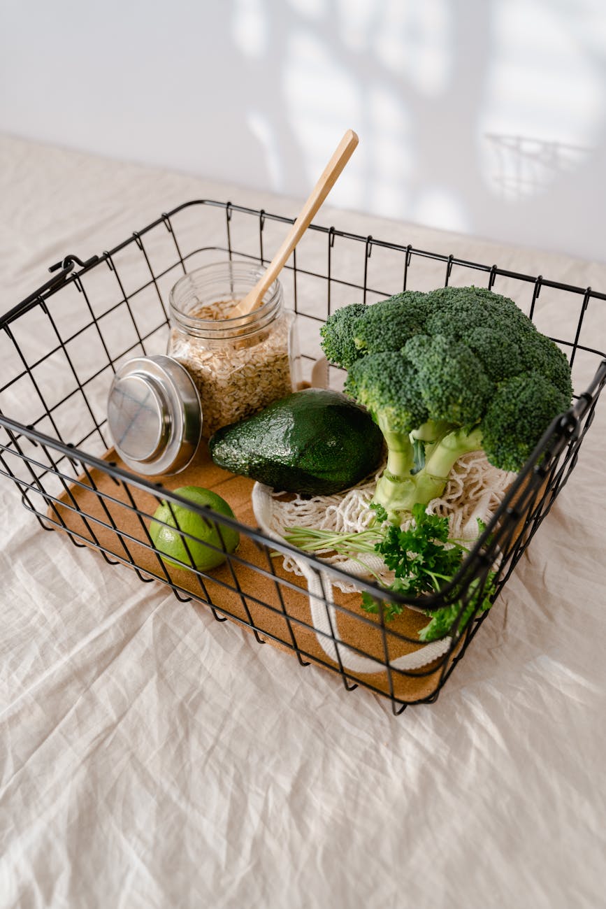 a jar of rolled oats fruits and vegetables in a metal basket